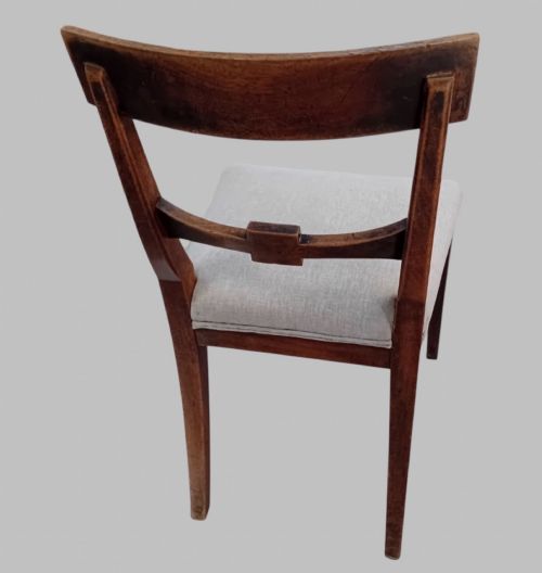 fig 2. A set of six late 19th-century mahogany dining chairs with geometric marquetry inlay and light grey upholstered seats.