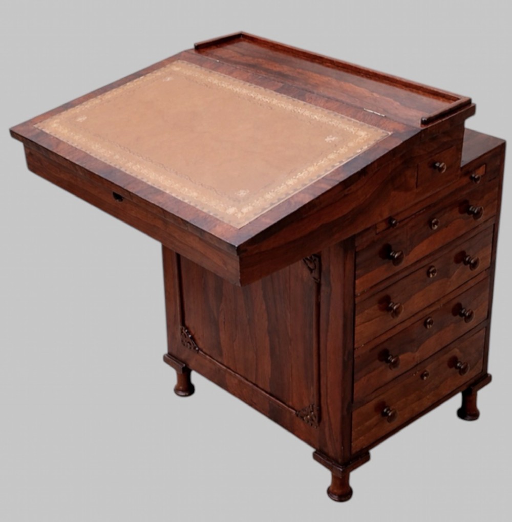 A Victorian rosewood Davenport desk featuring a slanted leather-tooled writing surface, side-mounted drawers, and turned feet. View II