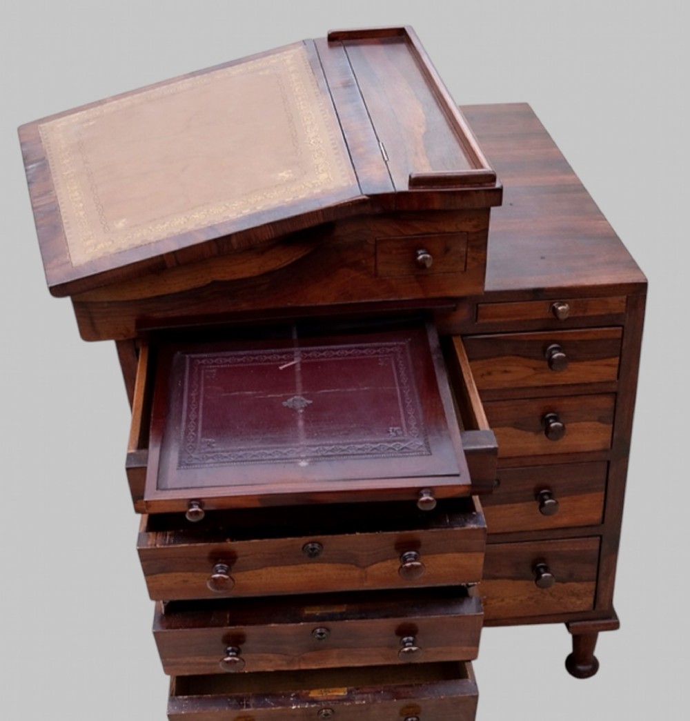 A Victorian rosewood Davenport desk featuring a slanted leather-tooled writing surface, side-mounted drawers, and turned feet. View III