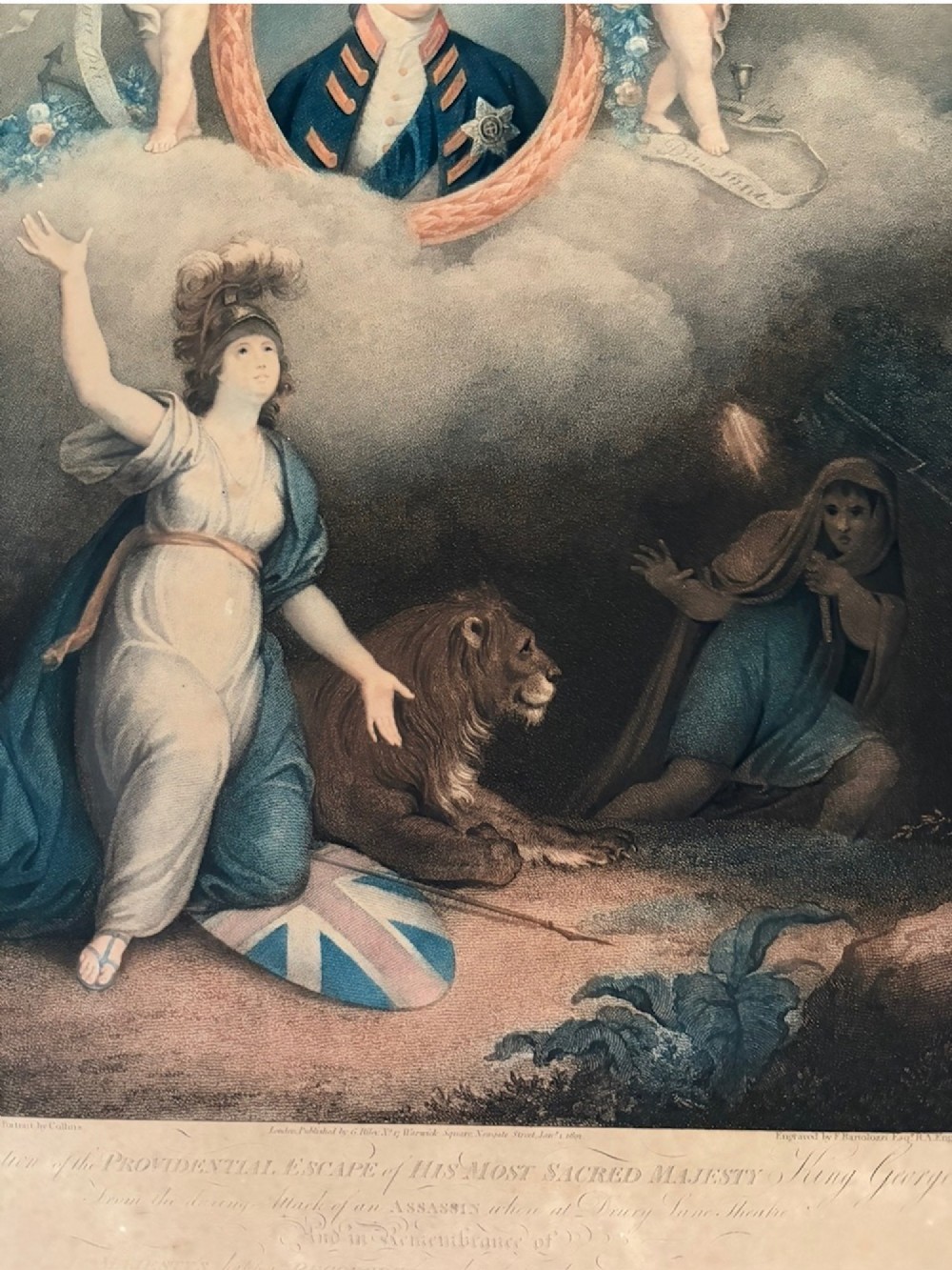 A framed 1802 Late-Georgian allegorical print depicting King George III surrounded by cherubs and classical figures within a carved gilt frame. View IV