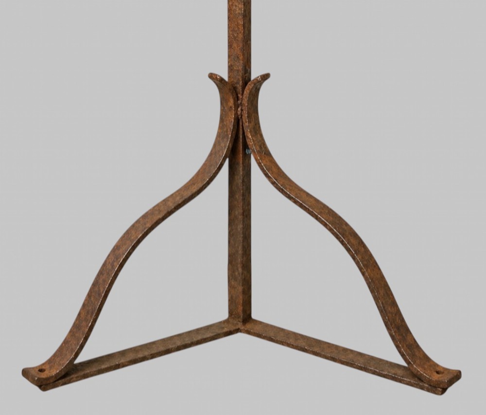 A tall dark wrought iron floor candelabrum featuring a triangular frame with fifteen candle sockets set upon a twisted central stem and tripod base. View II
