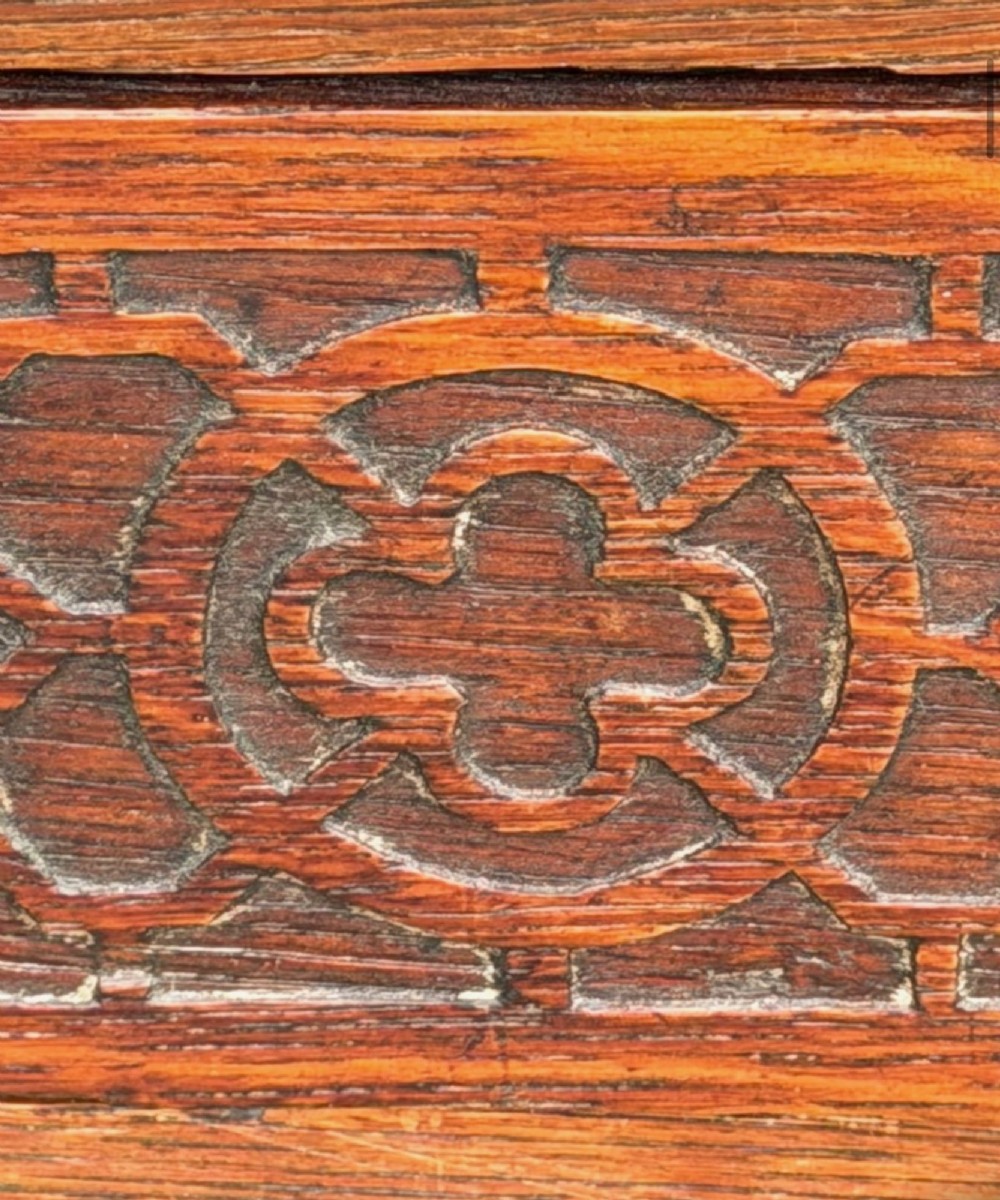 Victorian carved oak writing desk featuring a leather inset surface, two raised drawer cabinets on the top, two carved frieze drawers with brass drop handles, turned legs, and stretchers. View XIV