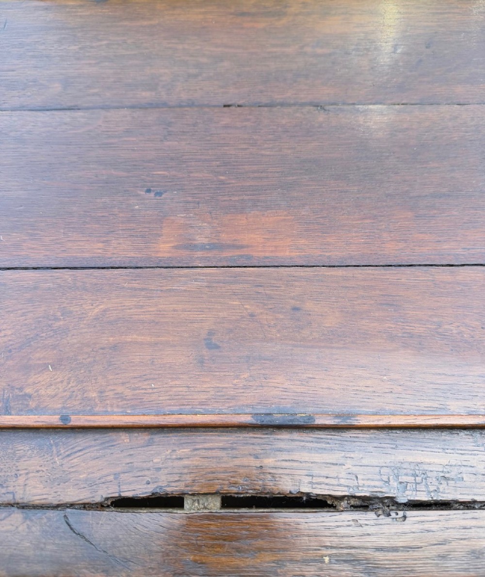 An 18th-century Welsh oak potboard dresser base featuring three frieze drawers with brass handles, a shaped apron, and a lower shelf. View XI