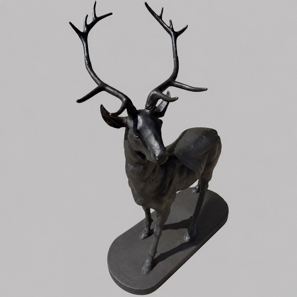 A patinated dark bronze sculpture depicting a standing young stag with antlers fixed onto an oval base. View II