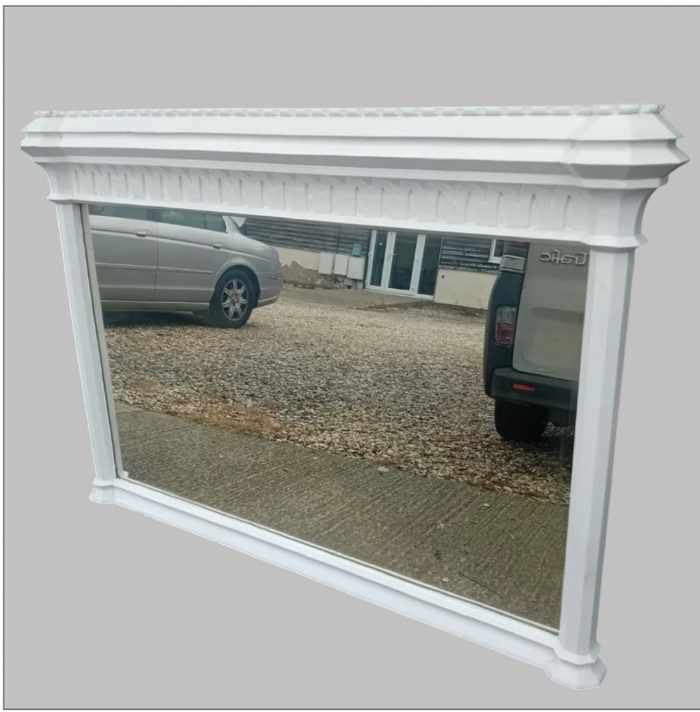 A large late Victorian rectangular overmantel mirror featuring a white painted wooden frame with a prominent corniced top and carved moulding. View II