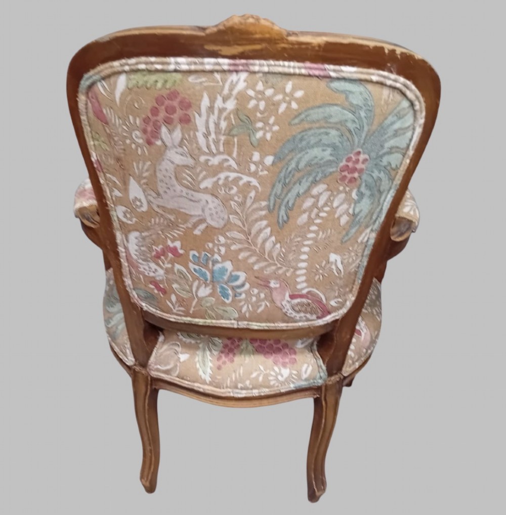 A pair of Neo-Rococo open armchairs featuring carved wooden frames, cabriole legs, and botanical tapestry upholstery. View II