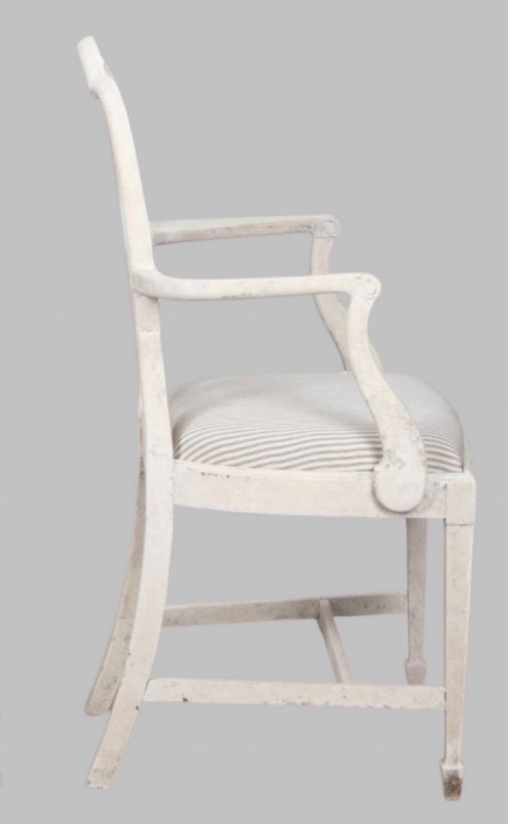 A set of eight off-white painted dining chairs featuring interlocking oval backrests, striped upholstered seats, including two carver armchairs and six side chairs. View IV
