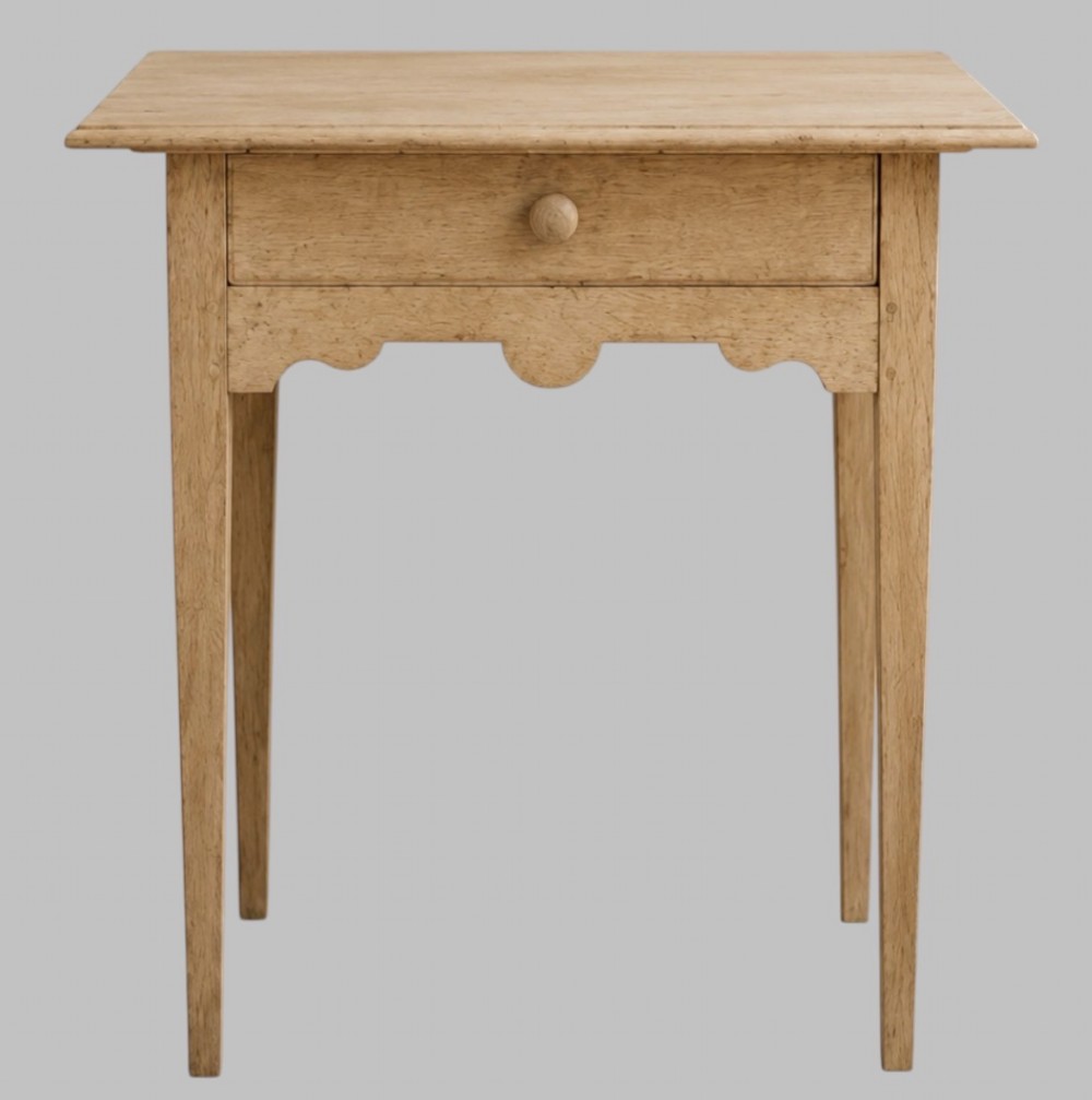 A mid-18th-century bleached oak side table featuring a single frieze drawer with a turned wooden knob, a shaped apron, and four square tapered legs. View II