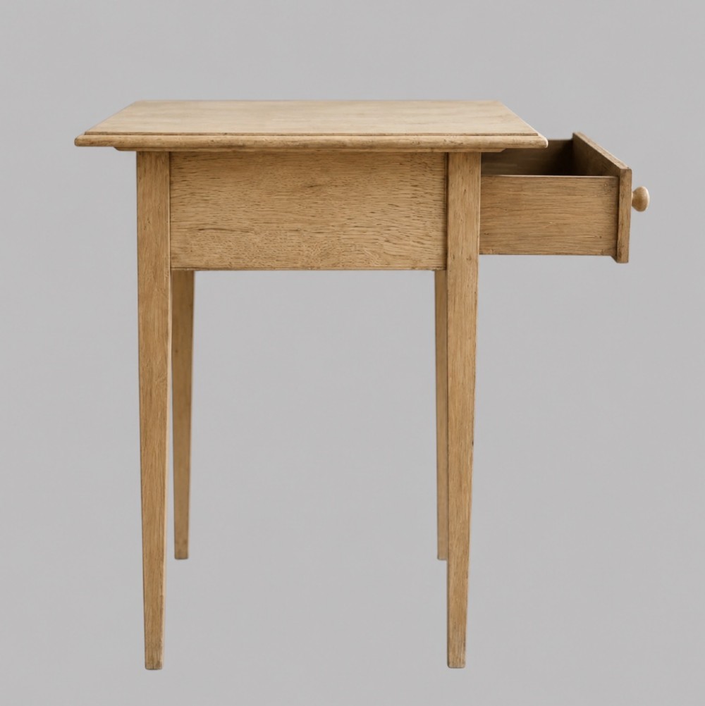 A mid-18th-century bleached oak side table featuring a single frieze drawer with a turned wooden knob, a shaped apron, and four square tapered legs. View III