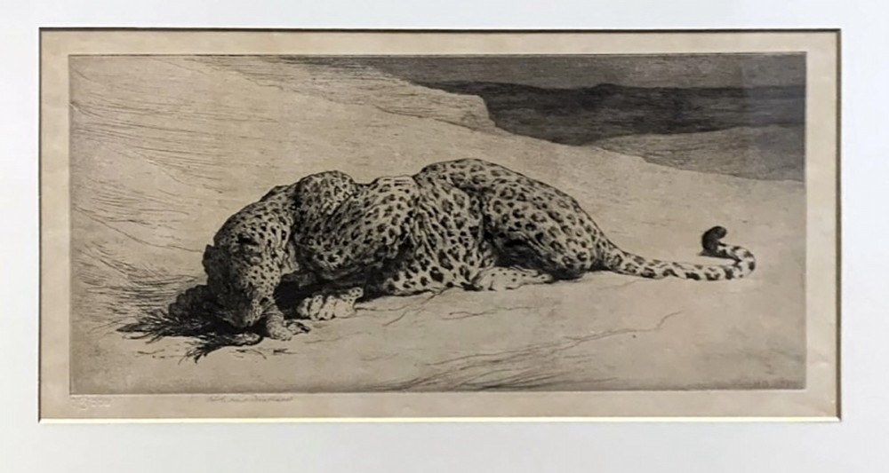A horizontal monochrome etching depicting a leopard crouching on sandy ground, presented in a cream mount and slim gilt frame. View II