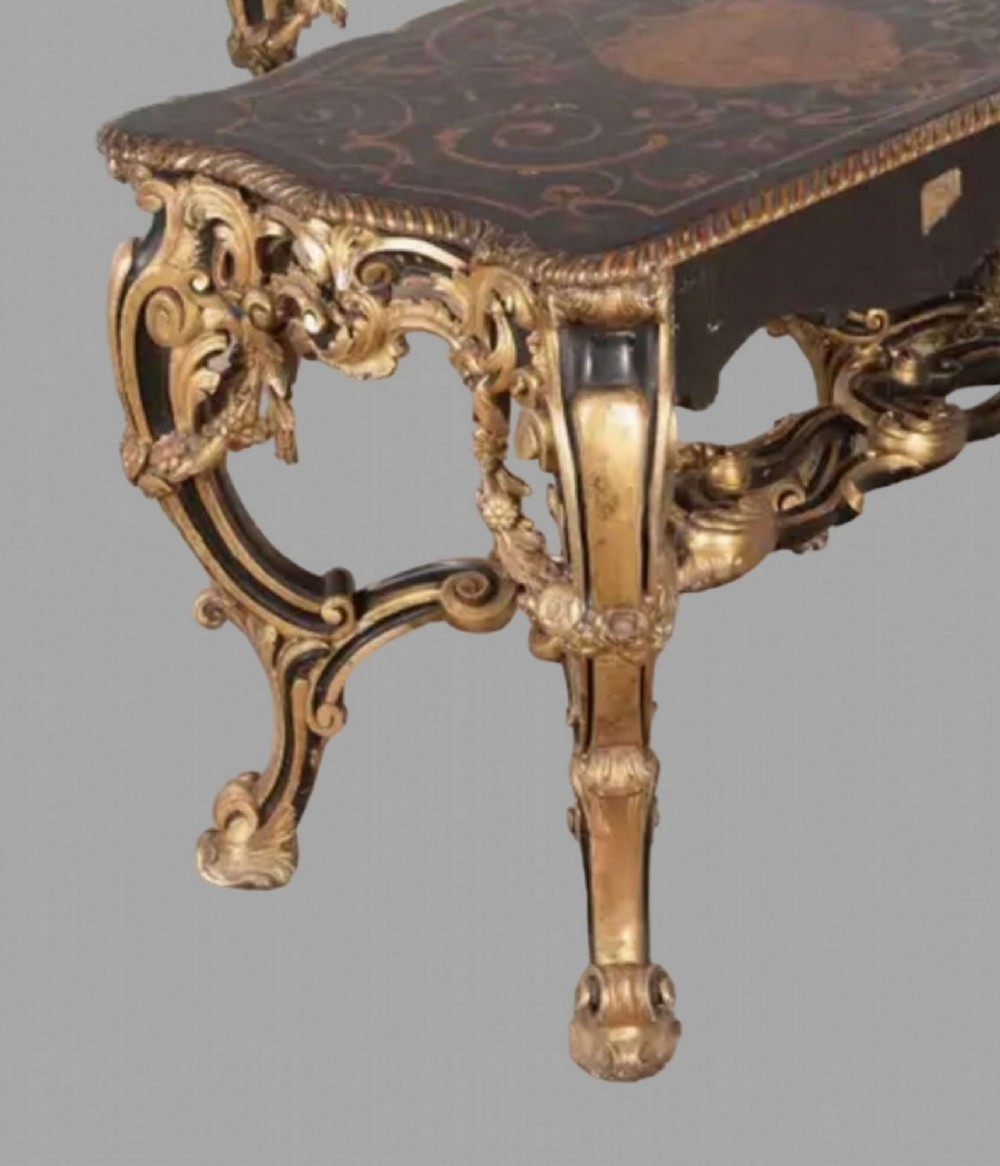 An L-shaped 19th-century Italian corner console table with elaborate gilded carvings, cabriole legs, and a detailed patterned top. View V