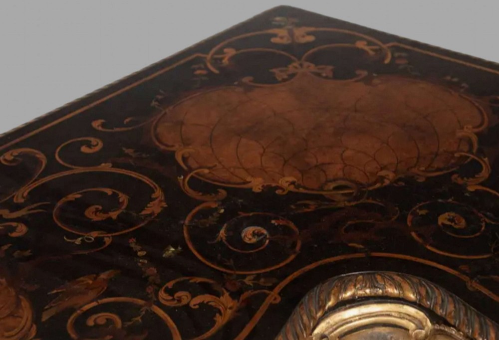 An L-shaped 19th-century Italian corner console table with elaborate gilded carvings, cabriole legs, and a detailed patterned top. View VI