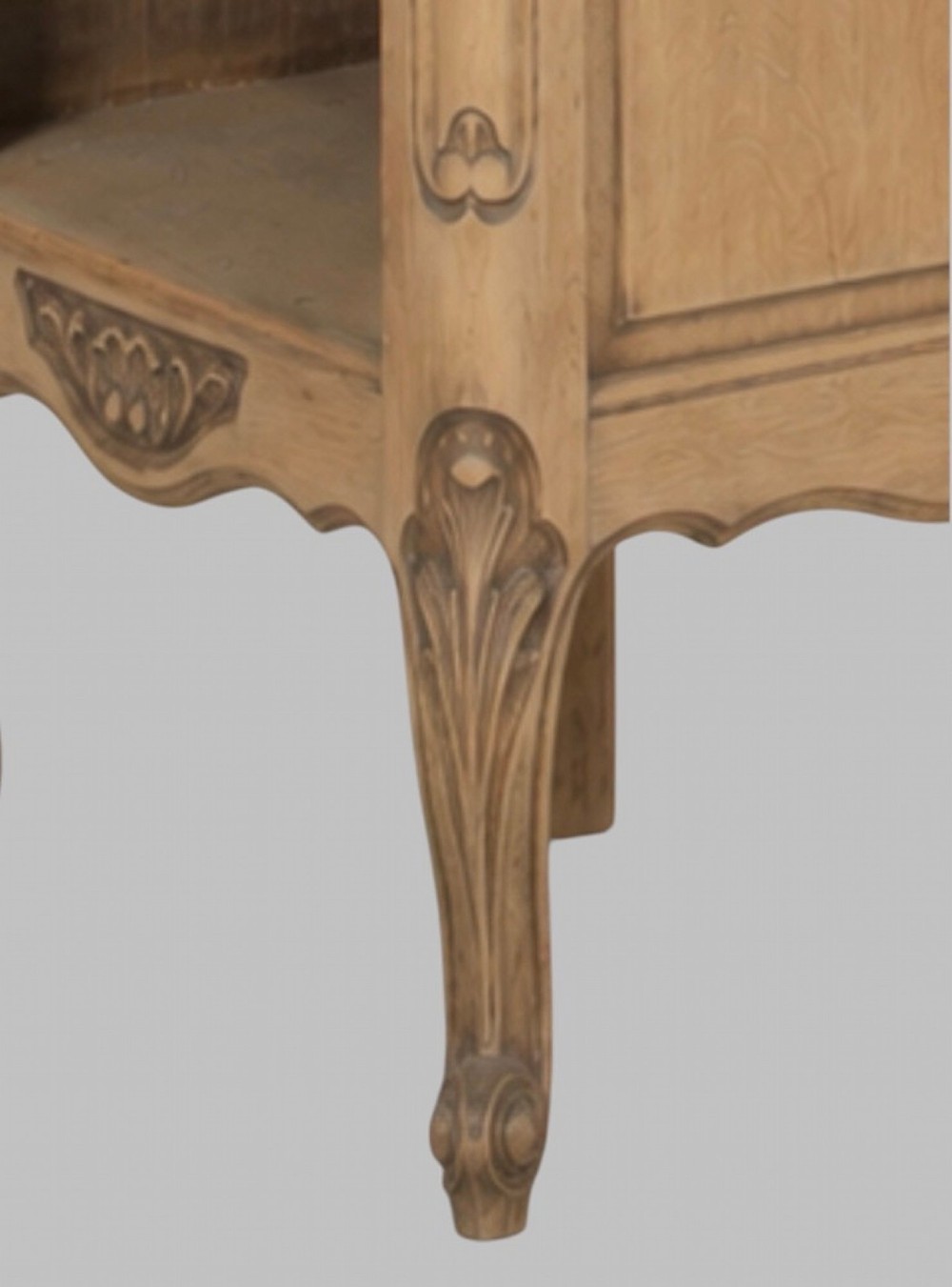 A pair of antique bleached oak bedside tables featuring carved cabriole legs, open storage shelves, and single top drawers with brass knobs. View IV