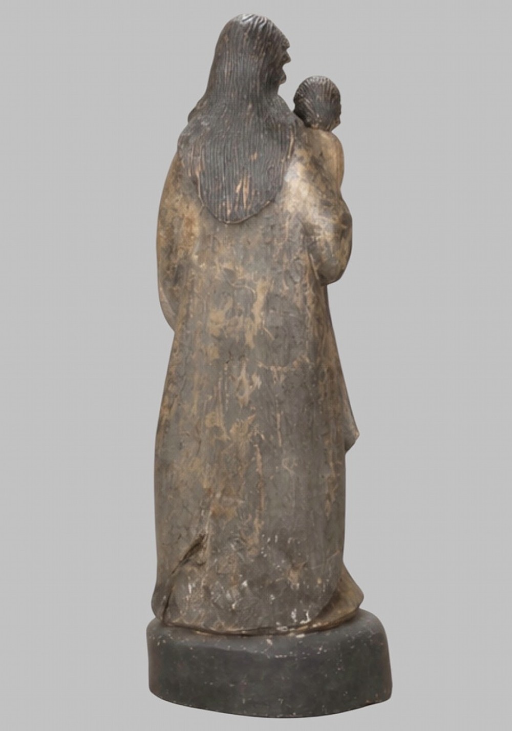 A carved wooden statue depicting the Virgin Mary holding the Infant Jesus on an integrated round base. View III