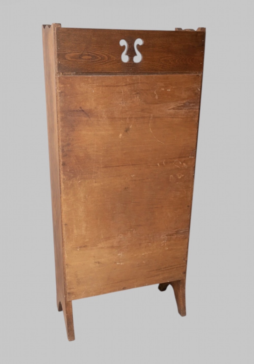 An early twentieth-century Arts and Crafts solid oak open bookcase featuring five shelves and a carved cut-out motif at the top. View III