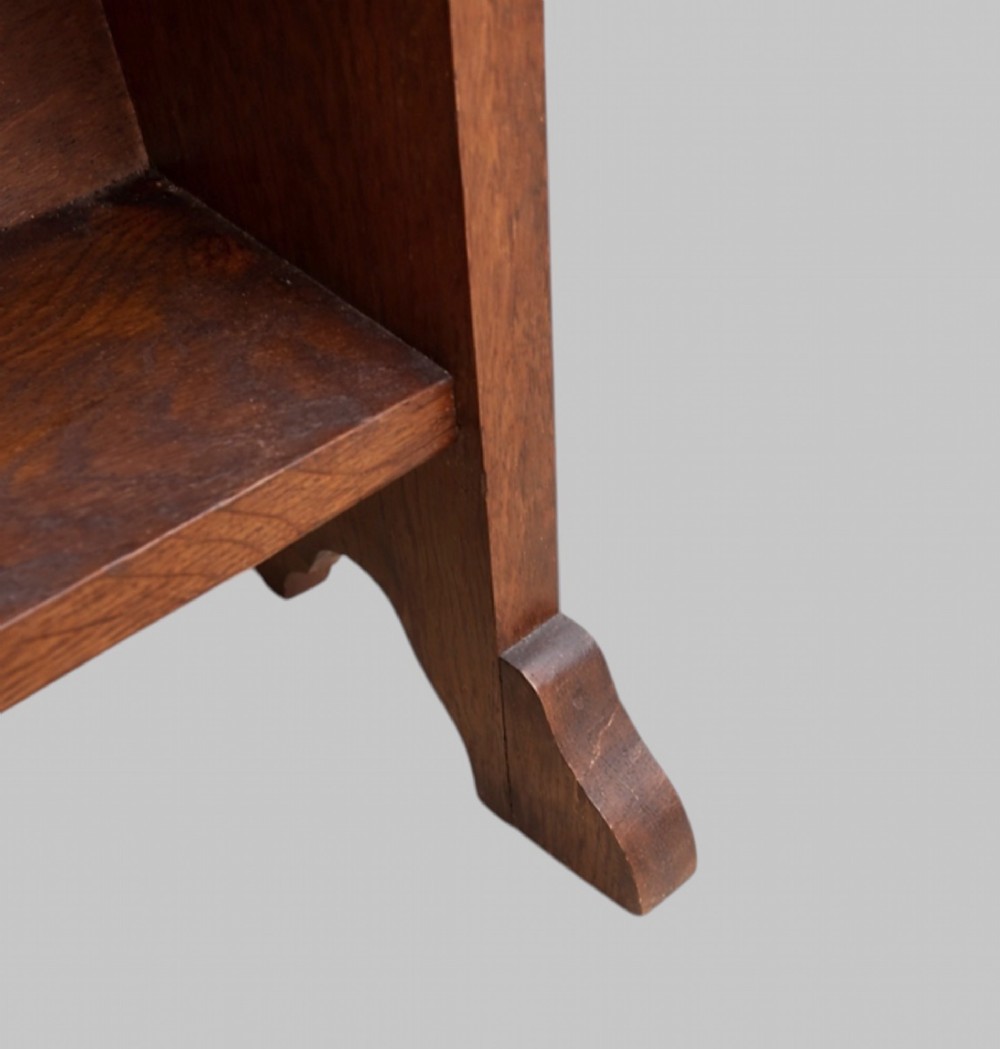 An early twentieth-century Arts and Crafts solid oak open bookcase featuring five shelves and a carved cut-out motif at the top. View IV