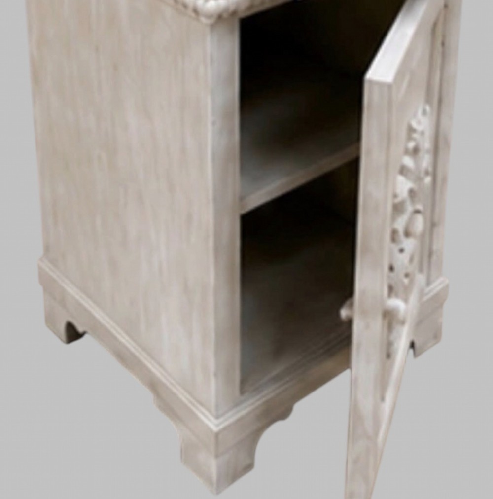 A pair of French off-white painted bedside cabinets featuring fitted marble tops, single drawers, and cupboard doors with central carved foliate relief motifs. View IV