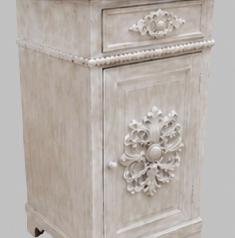 A pair of French off-white painted bedside cabinets featuring fitted marble tops, single drawers, and cupboard doors with central carved foliate relief motifs. View V