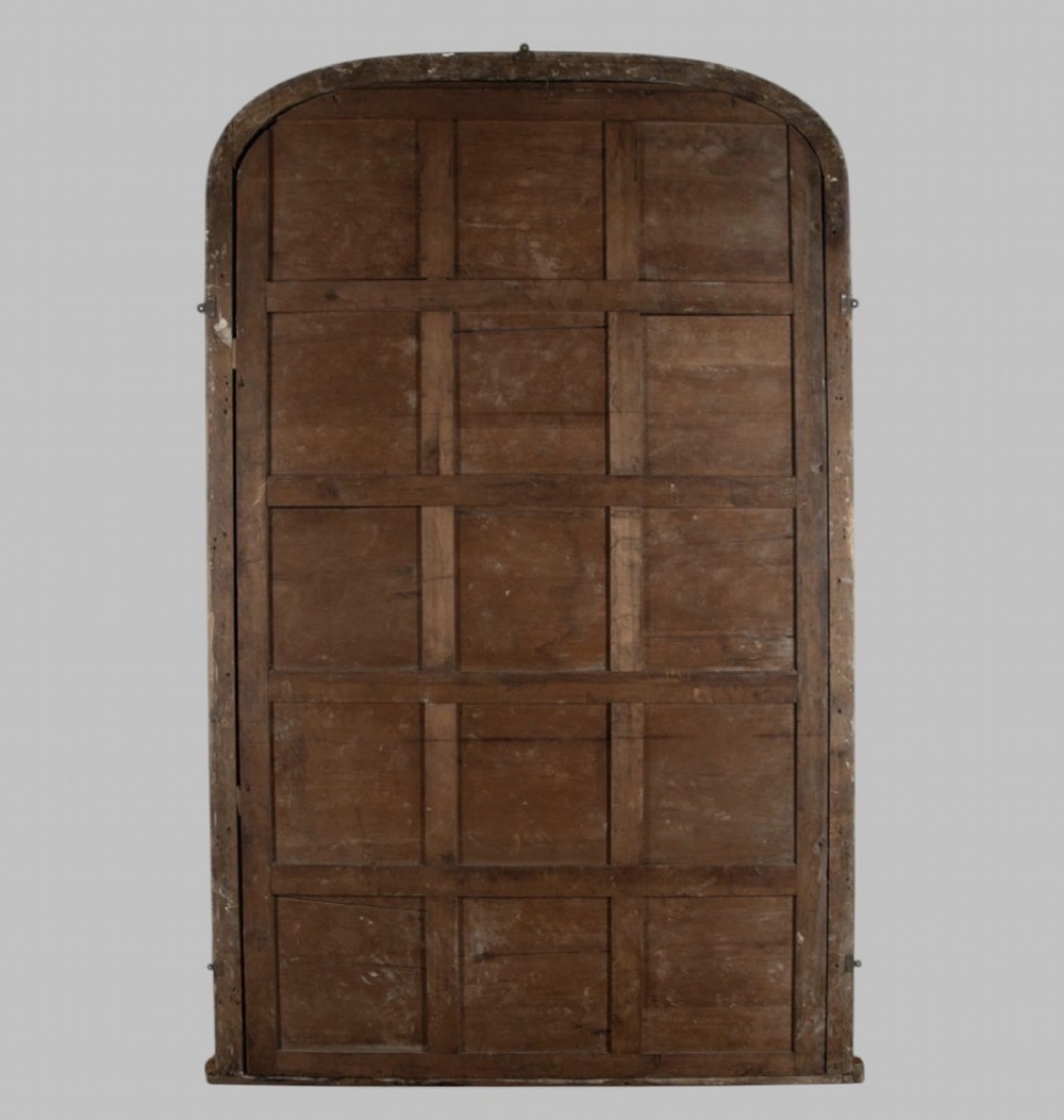 A large nineteenth-century giltwood pier mirror with an arched upper frame and beaded moulding detail. View IV