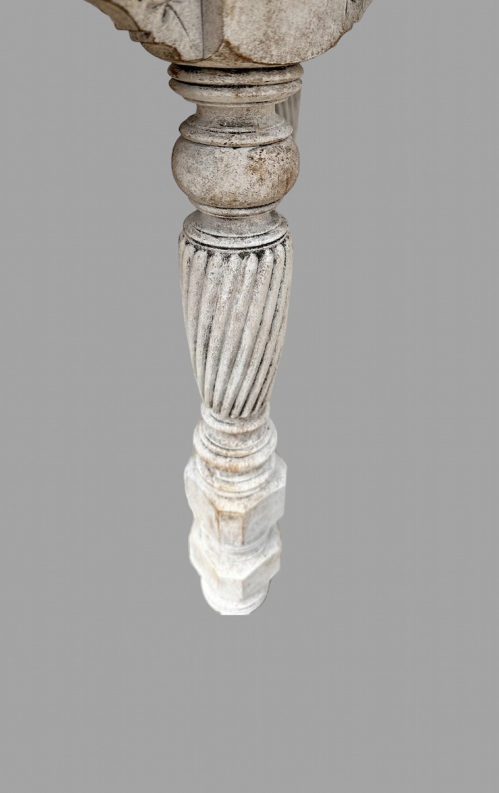 A late 19th-century round centre table with a dark top, distressed grey painted base, spiral turned legs, and an X-frame stretcher with a central finial. View V