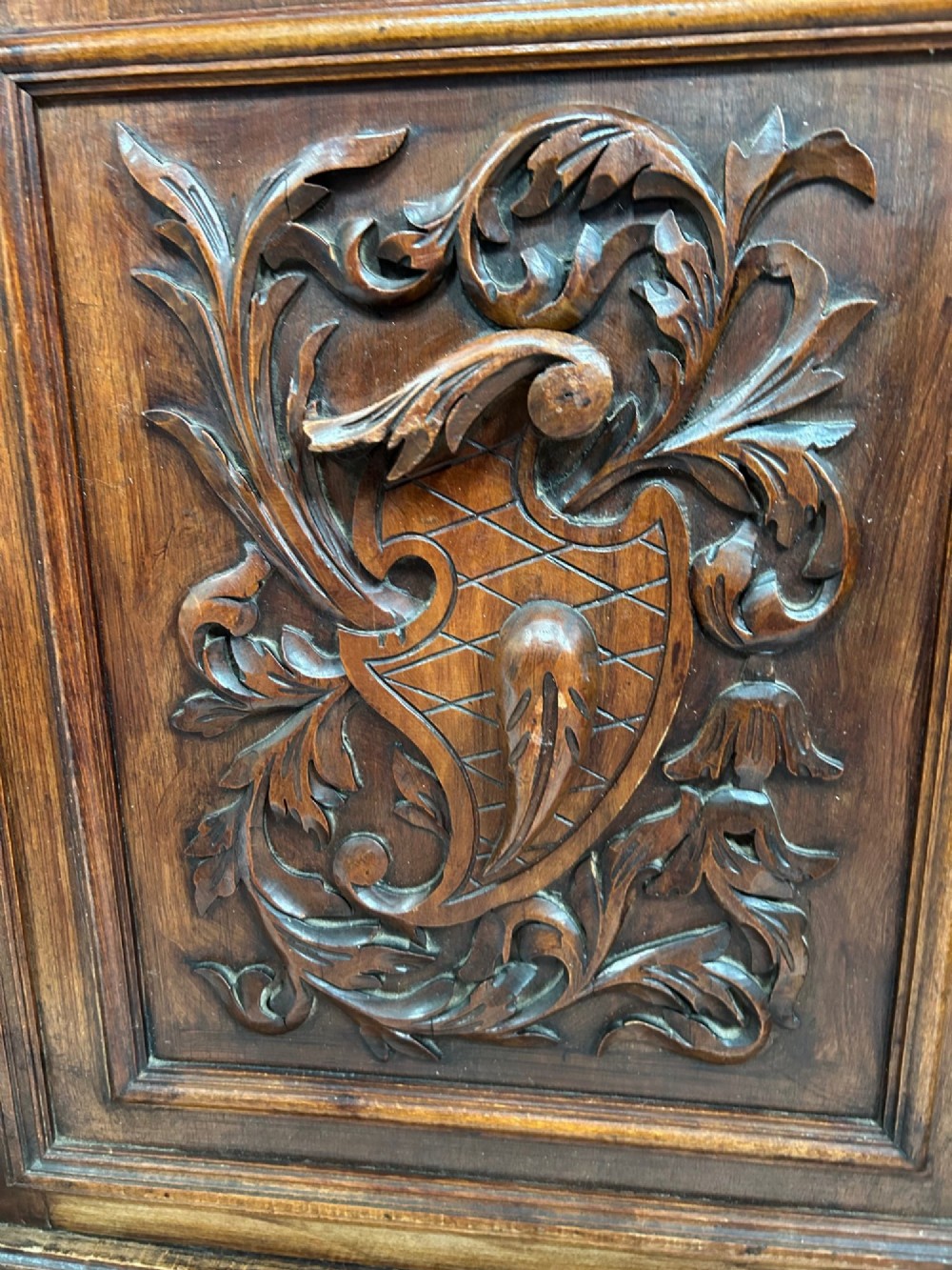 A late 19th-century French Provincial walnut dresser featuring hand-carved relief panels, glazed side cabinets, turned support columns, and a green marble insert surface. View VIII