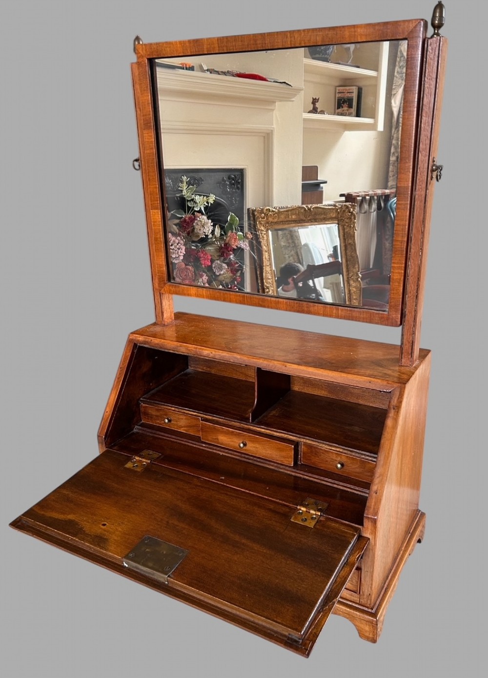 An Edwardian satinwood tabletop bureau featuring a slant-front writing slope over small drawers, topped with a rectangular swivel dressing mirror. View II