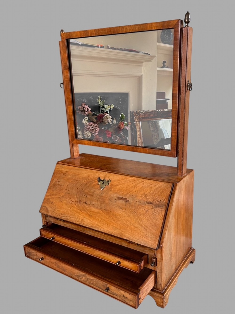 An Edwardian satinwood tabletop bureau featuring a slant-front writing slope over small drawers, topped with a rectangular swivel dressing mirror. View III