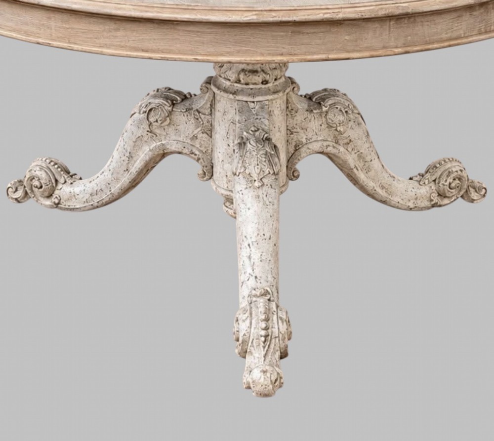 A circular mid-19th-century centre table featuring a bleached mahogany top supported by a carved tripod pedestal base. View III