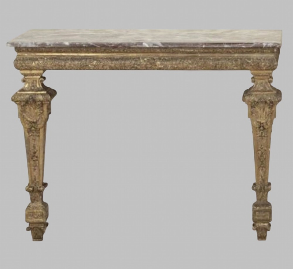 A pair of 19th-century Italian giltwood console tables featuring carved tapered legs and fitted marble tops. View III