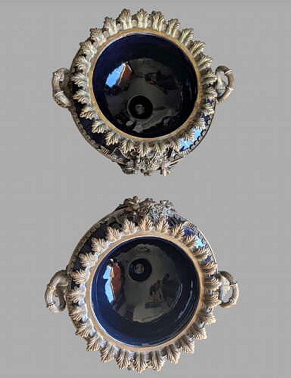 A pair of 19th-century dark blue ceramic jardinieres featuring ornate gilt metal mounts, dual scroll handles, and flared pedestal bases. View II