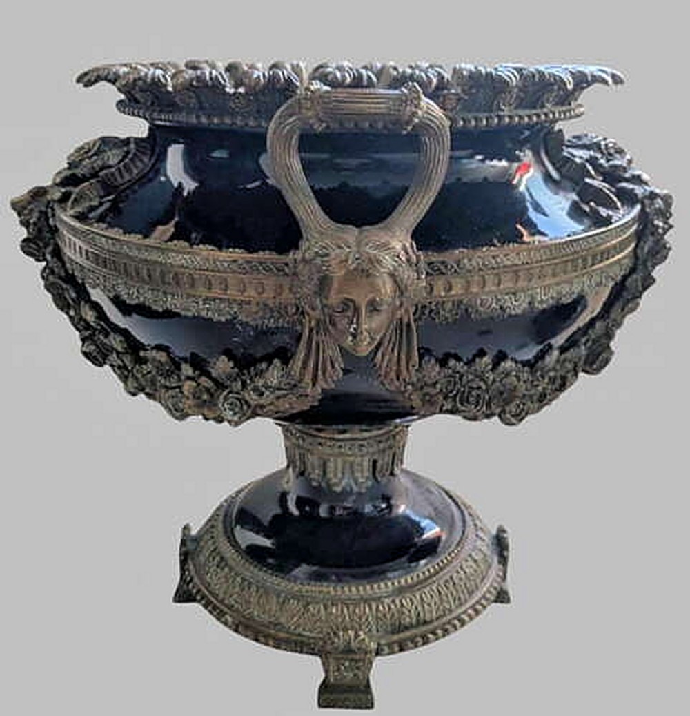A pair of 19th-century dark blue ceramic jardinieres featuring ornate gilt metal mounts, dual scroll handles, and flared pedestal bases. View III