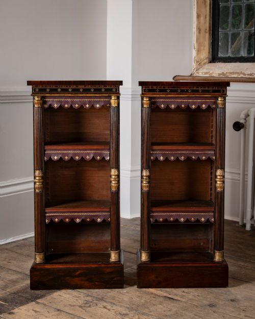A PAIR OF REGENCY BRASS INLAID ROSEWOOD OPEN BOOKCASES