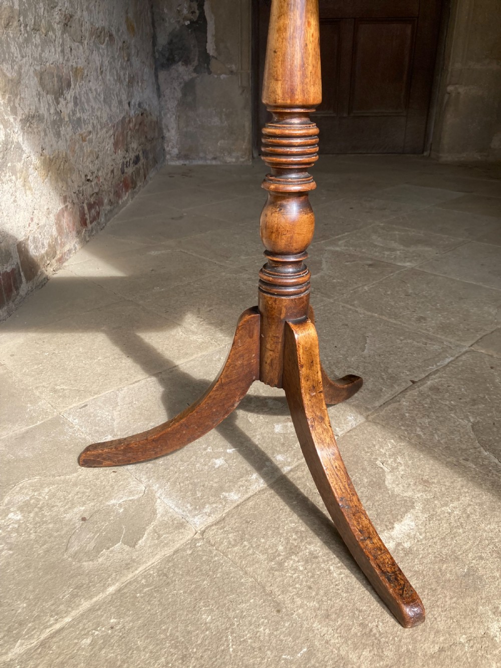 A Regency mahogany tripod table featuring a rectangular surface with rounded corners, a central turned stem, and three splayed legs. View IV