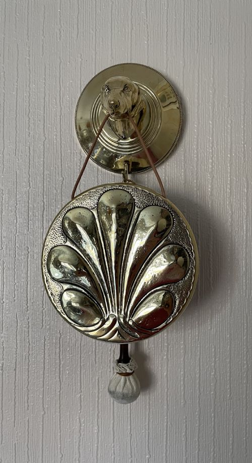 Wall Mounted Gong Held in Dog’s Mouth
