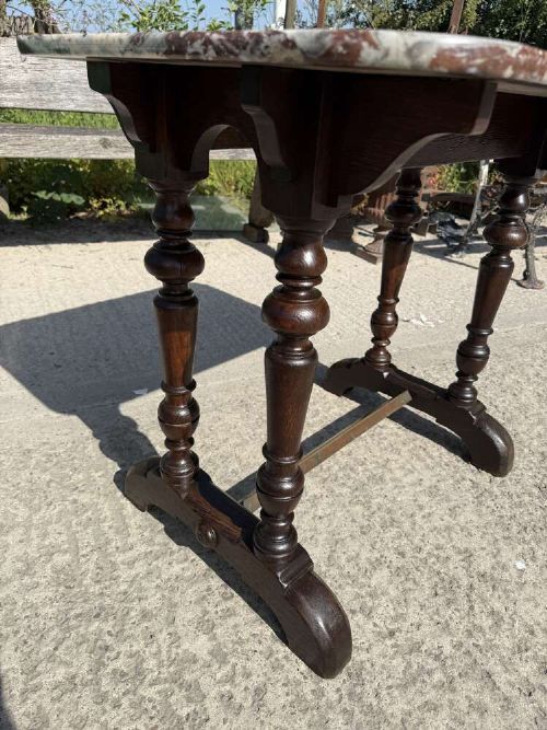 A 19th-century French table a gibier featuring a red and grey veined marble top resting on a dark turned timber base with a low stretcher. View IV