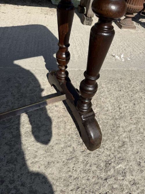 A 19th-century French table a gibier featuring a red and grey veined marble top resting on a dark turned timber base with a low stretcher. View IX