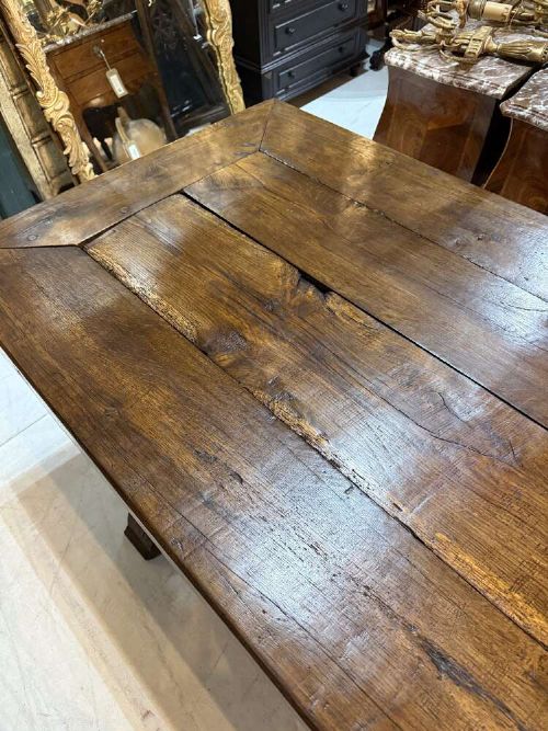 A long late 19th-century French oak refectory table featuring a thick plank top with cleated ends resting on sturdy trestle legs and a stretcher base. View VIII