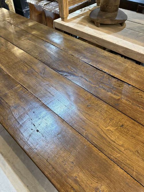 A long late 19th-century French oak refectory table featuring a thick plank top with cleated ends resting on sturdy trestle legs and a stretcher base. View X
