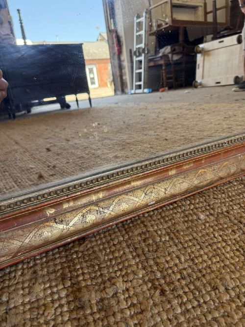 A late nineteenth-century French rectangular wall mirror featuring rounded upper corners, an incised gold gilt frame, and a beaded inner border. View VII