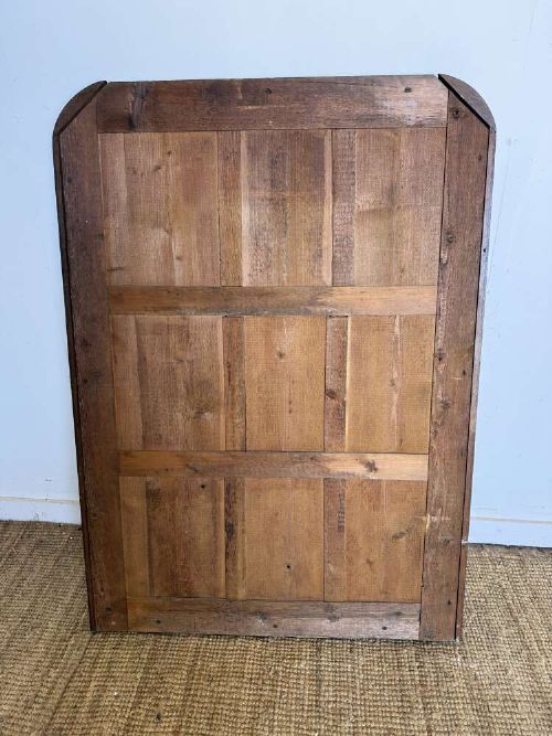 A late 19th-century French carved oak wall mirror with rounded top corners and detailed carved egg and dart moulding along the frame. View VI