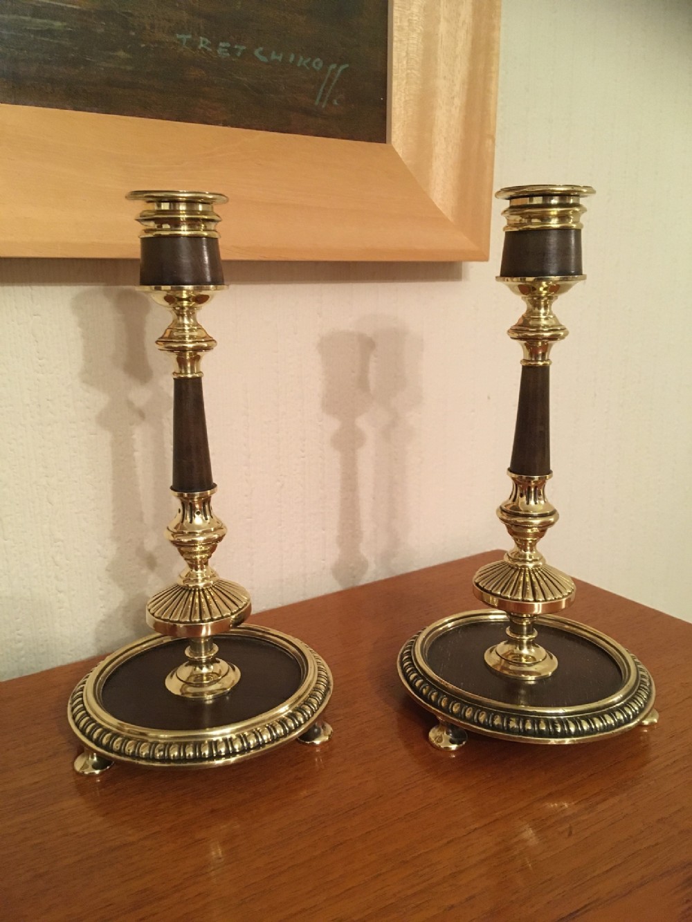 PAIR OF BRASS AND MAHOGANY CANDLESTICKS 