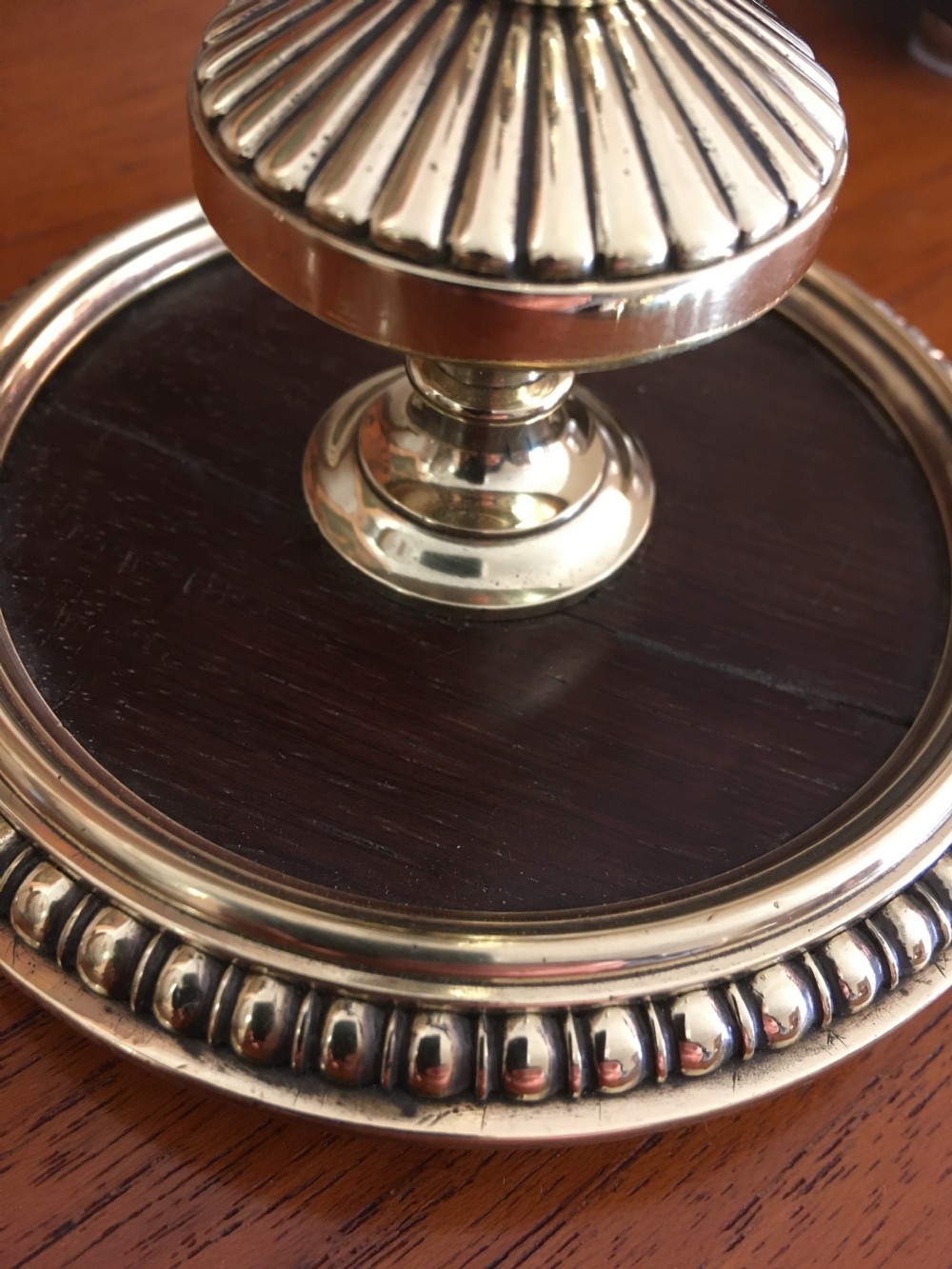 PAIR OF BRASS AND MAHOGANY CANDLESTICKS  View VI