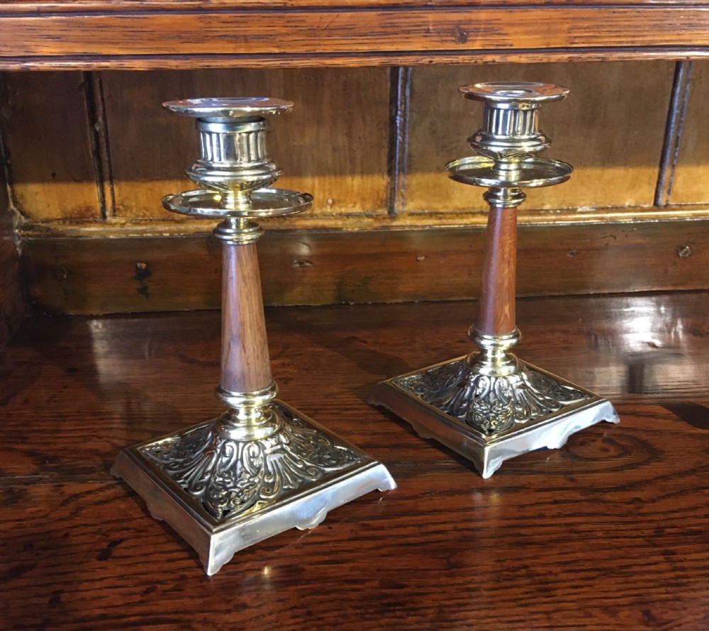 PAIR OF BRASS AND WOOD CANDLESTICKS 
