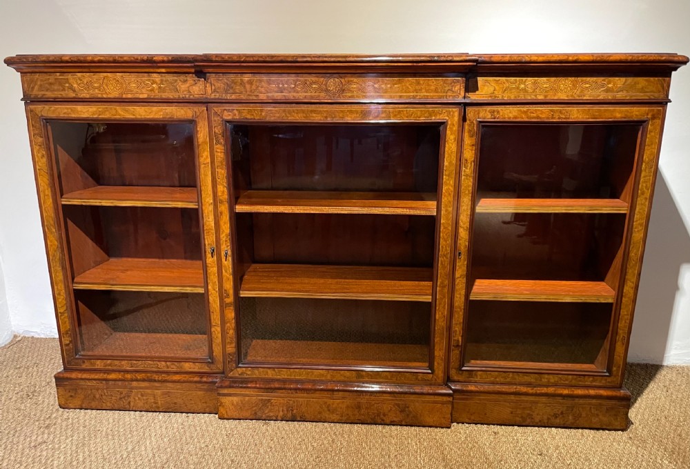 Walnut break front bookcase 