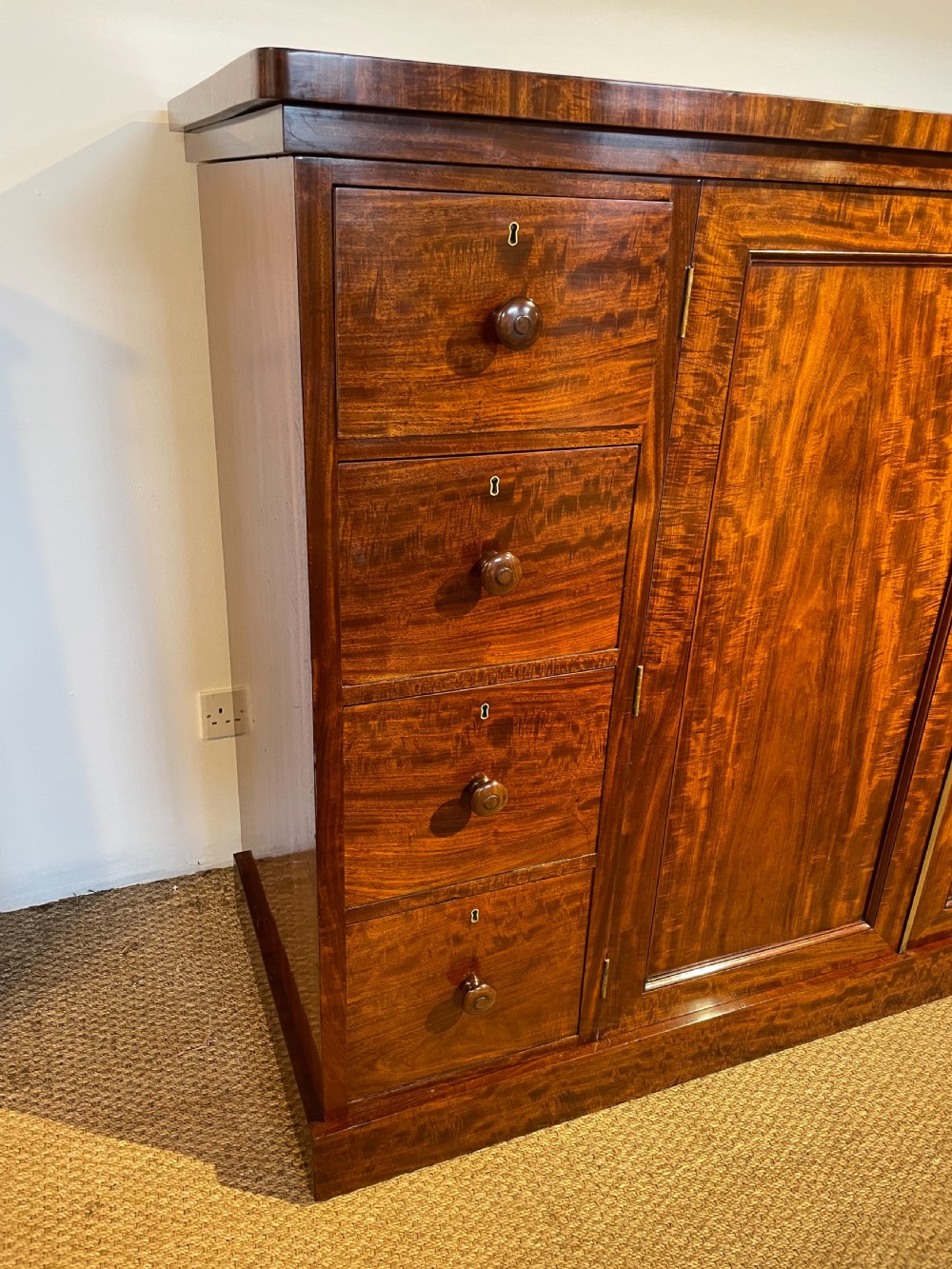 Low wide mahogany linen press  View VIII