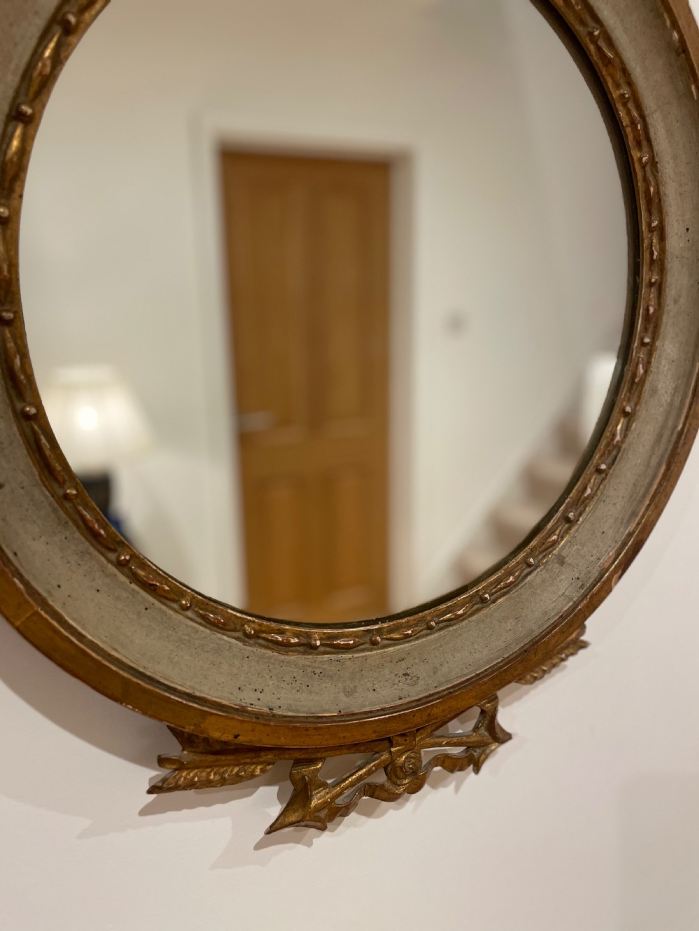 Round mirror with torch and quiver cresting  View II