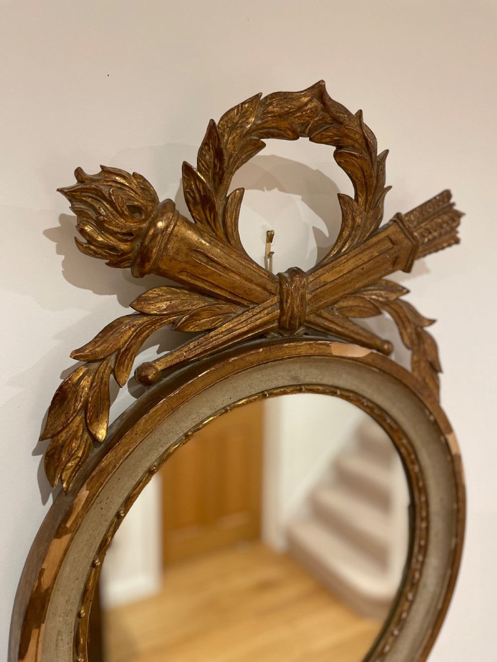 Round mirror with torch and quiver cresting  View V