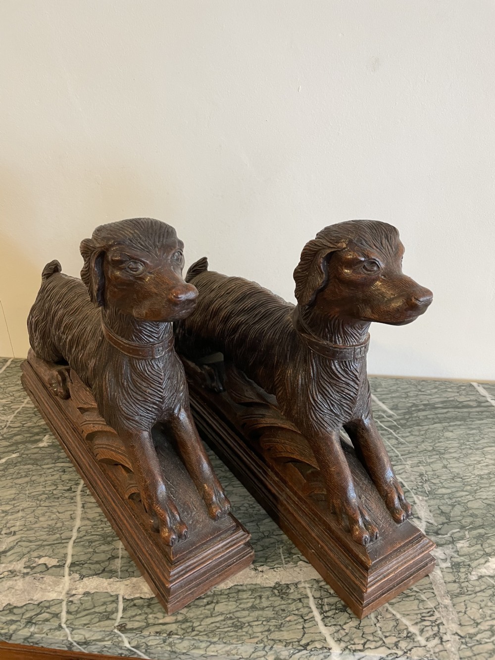 Pair of carved wooden spaniels 