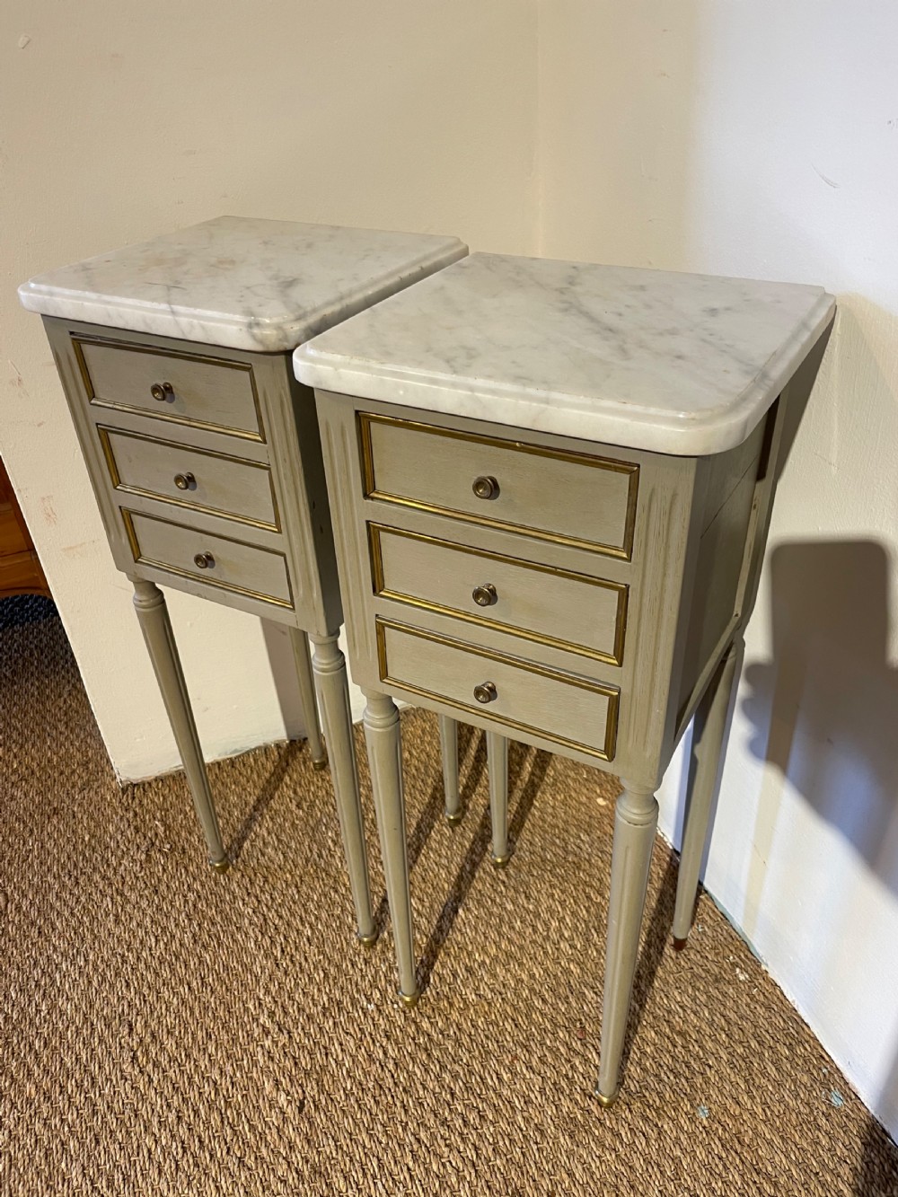 Very neat sized pair of marble topped bedside cabinets 