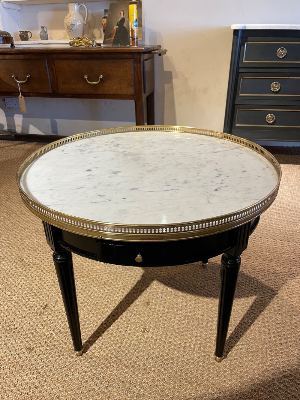 Small round ebonised coffee table 